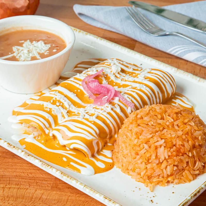 Tulum OC signature dishes Cochinita PibilTulumquenaLobster Enchiladas